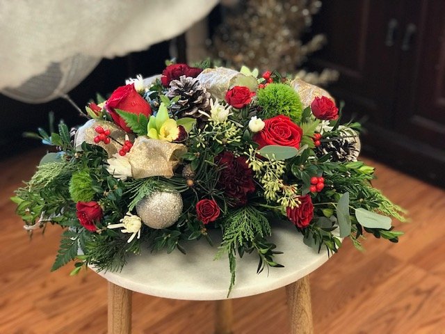 Glittered cedar and eucalyptus winter floral arrangement